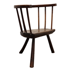  Late 18th century Welsh oak and elm primative stick back armchair, D shaped seat with curved top rail on three outsplayed supports, W60cm, D34cm, H64cm  