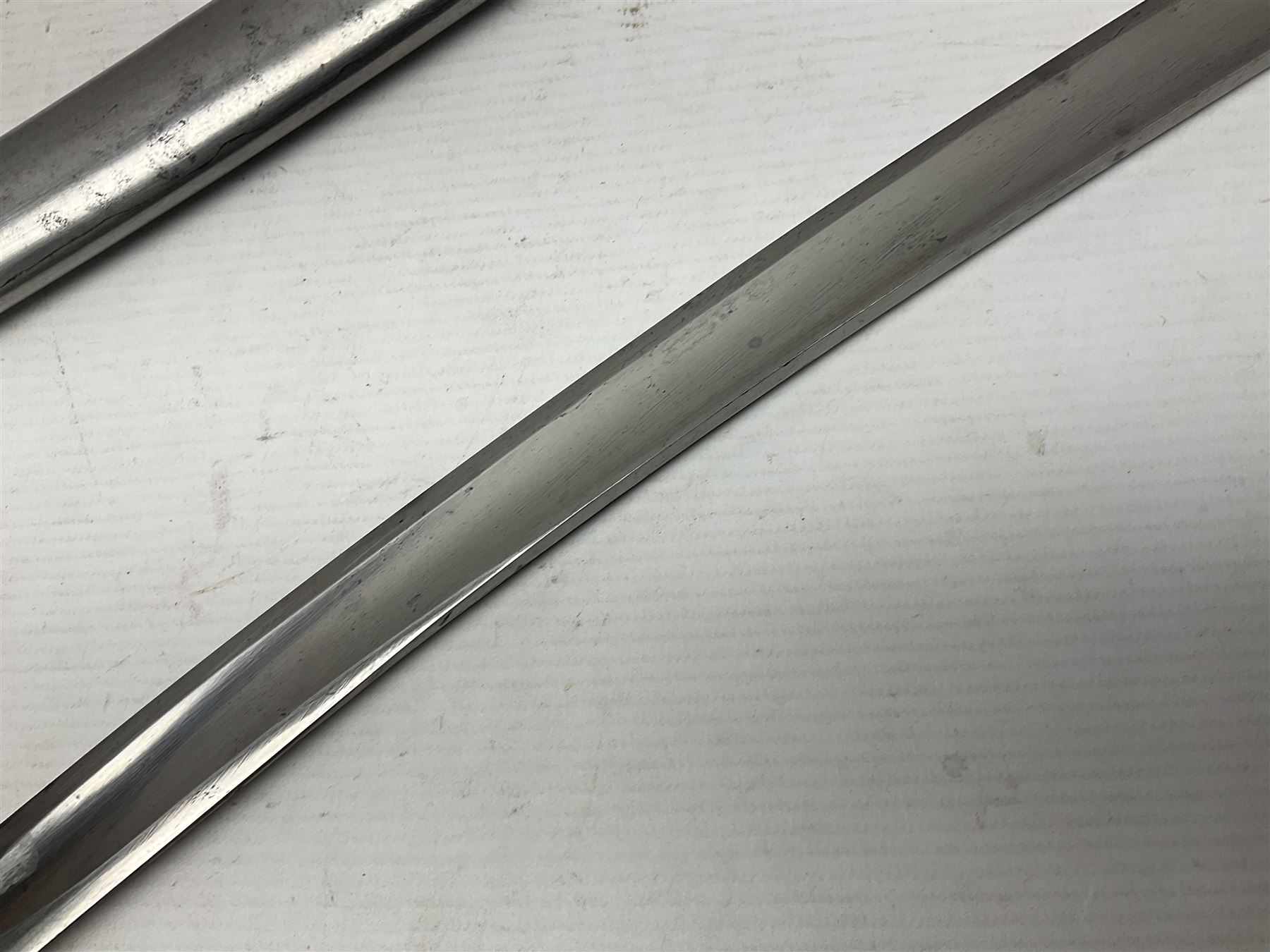 Early 19th century French Lancers officer's sword c1810, the 84cm curving fullered blade retaining most of its bluing, gilding and engraved decoration, inscribed I.S.& C. to ricasso (for Schimelbusch), brass three-bar hilt with elongated elliptical langets and wire-bound leather grip; in polished steel scabbard with two brass suspension rings L100cm overall