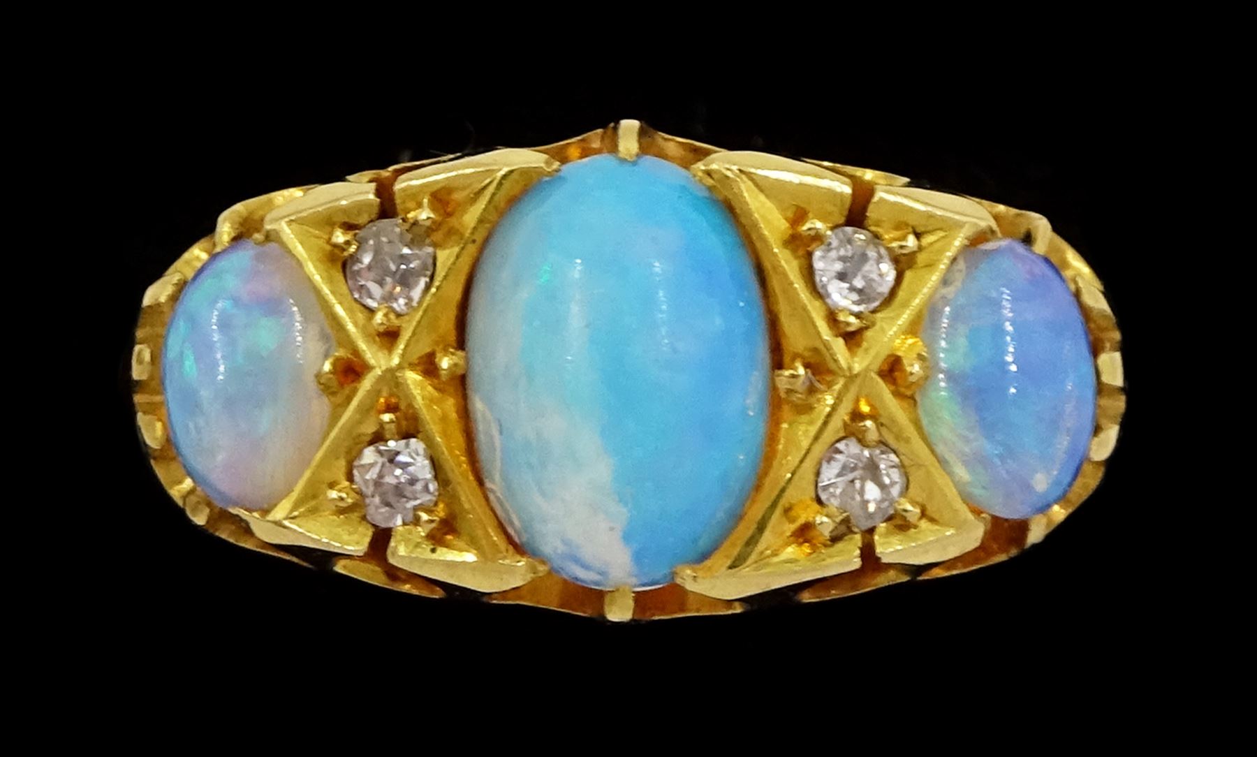 Victorian 18ct gold three stone opal ring, with four diamond accents set between