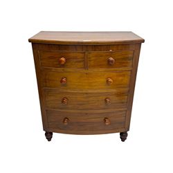 Victorian mahogany bow-fronted chest, fitted with two short over three long graduated cockbeaded drawers, on turned bun supports