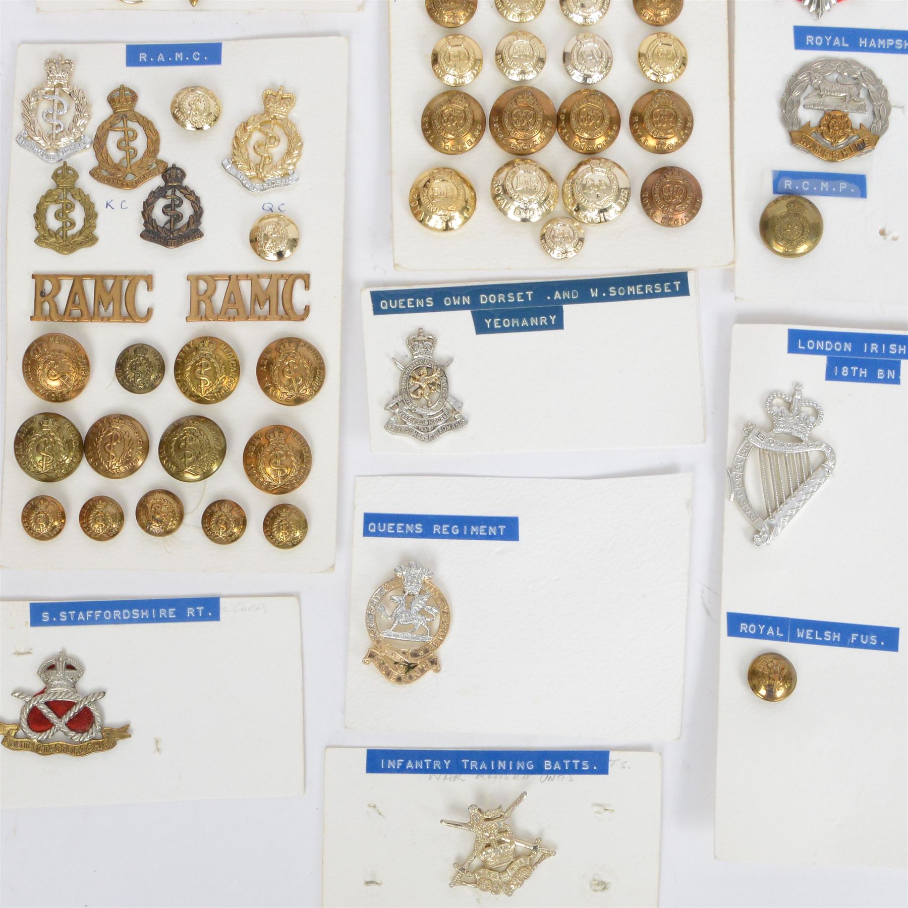 Collection of military cap badges, buttons and similar, including examples for Royal Army Medical Corps, Royal Army Pay Corps, Royal Engineers etc 