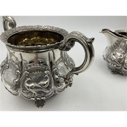 Victorian silver three piece tea service, comprising teapot, twin handled open sucrier, and milk jug, each of bellied form with acanthus capped scroll handles, the sides embossed with alternating scroll edged vacant panels and panels containing a pair of birds, upon four palmette feet, the teapot with ivory insulators to handle, and bird finial to the hinged domed cover, hallmarked William Hunter & Son, London 1861, teapot H19cm, including handles sucrier H13.5cm, including handle milk jug H12cm

This item has been registered for sale under Section 10 of the APHA Ivory Act