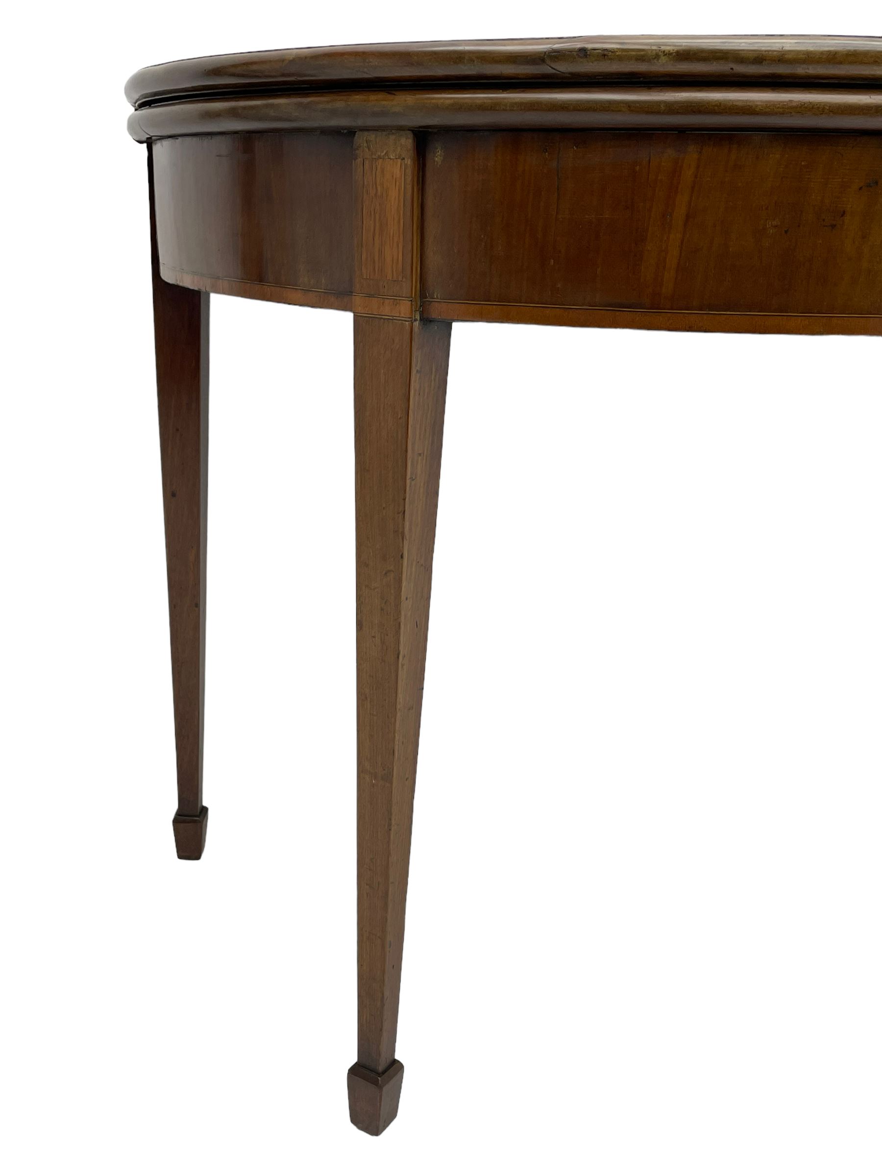 George III inlaid mahogany card table, demi-lune fold-over top with satinwood band and large fan motif, baize lined interior, double gate-leg action base, on square tapering supports with spade feet