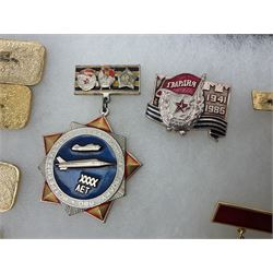 Nineteen Russian Soviet Tank Commemoration badges and medals, in small display case
