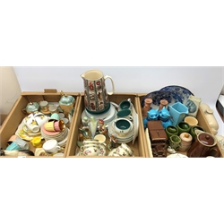  Beswick Siamese cat figure and dog pin dish, Goebel chick egg cup, Wade Cairn Terrier dog figure pipe dish, Royal Doulton stoneware hot water bottles, Sylvac swan posy vase and other ceramics in three boxes  