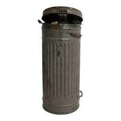 WWII German armed forces gas mask, housed in the original issue tin, tin H27cm