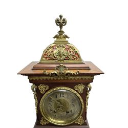 Lenzkirch - Edwardian German 8-day  mantle clock in an oak case with brass mounts and a pierced dome pediment with finial, silvered dial with Arabic numerals, gilt hands and dial centre, rack striking movement, striking the hours and half-hours on a coiled gong. With pendulum and key.