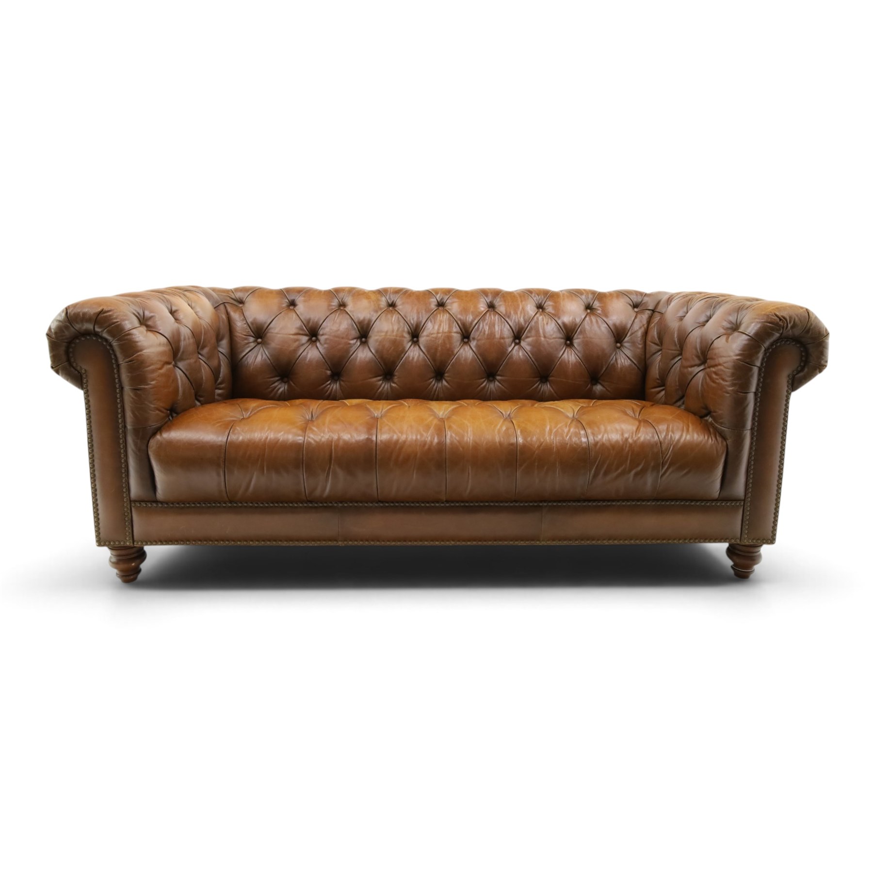 Barker and Stonehouse - traditional shape 'Ullswater' three seater Chesterfield club sofa, rolled back and arms upholstered in buttoned tan leather with studwork, raised on turned feet