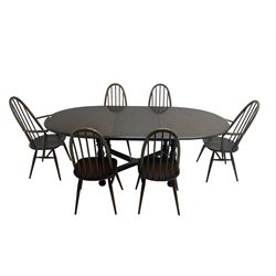 Ercol - 'Old Colonial' 705 elm extending dining table, oval top with hidden leaf, raised on turned supports united by X-stretcher (W163cm D108cm H72cm); and Ercol - set six  (4+2) dark elm 'Quaker Back Windsor Dining Chairs', hoop and stick backs 