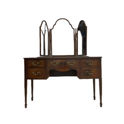 Early 20th century bow front mahogany dressing table, triple mirror back over five drawers, square tapering supports with spade feet