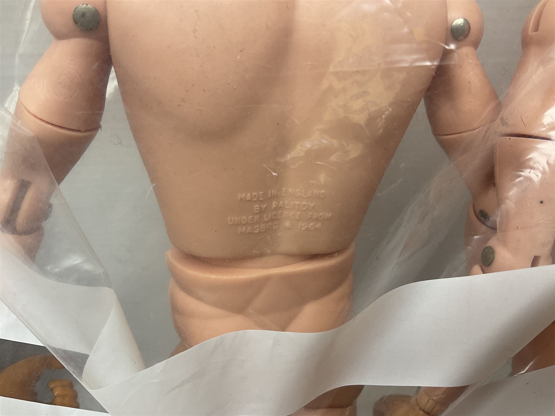 Action Man - large collection of 1960s and later figures and accessories including Spaceman with ATLRV vehicle; two figures marked 'Made in England by Palitoy under licence from Hasbro 1964'; twenty-five assorted weapons; radio backpacks; kit bags; twenty-one pairs of boots; football boots and snow shoes; metal diver's boots and three pairs of flippers; two pairs of jackboots; roller skates; various tunics, trousers, flying suits, jumpers, belts etc; twenty helmets, berets, busby, kepis, submariner etc; and quantity of other accessories