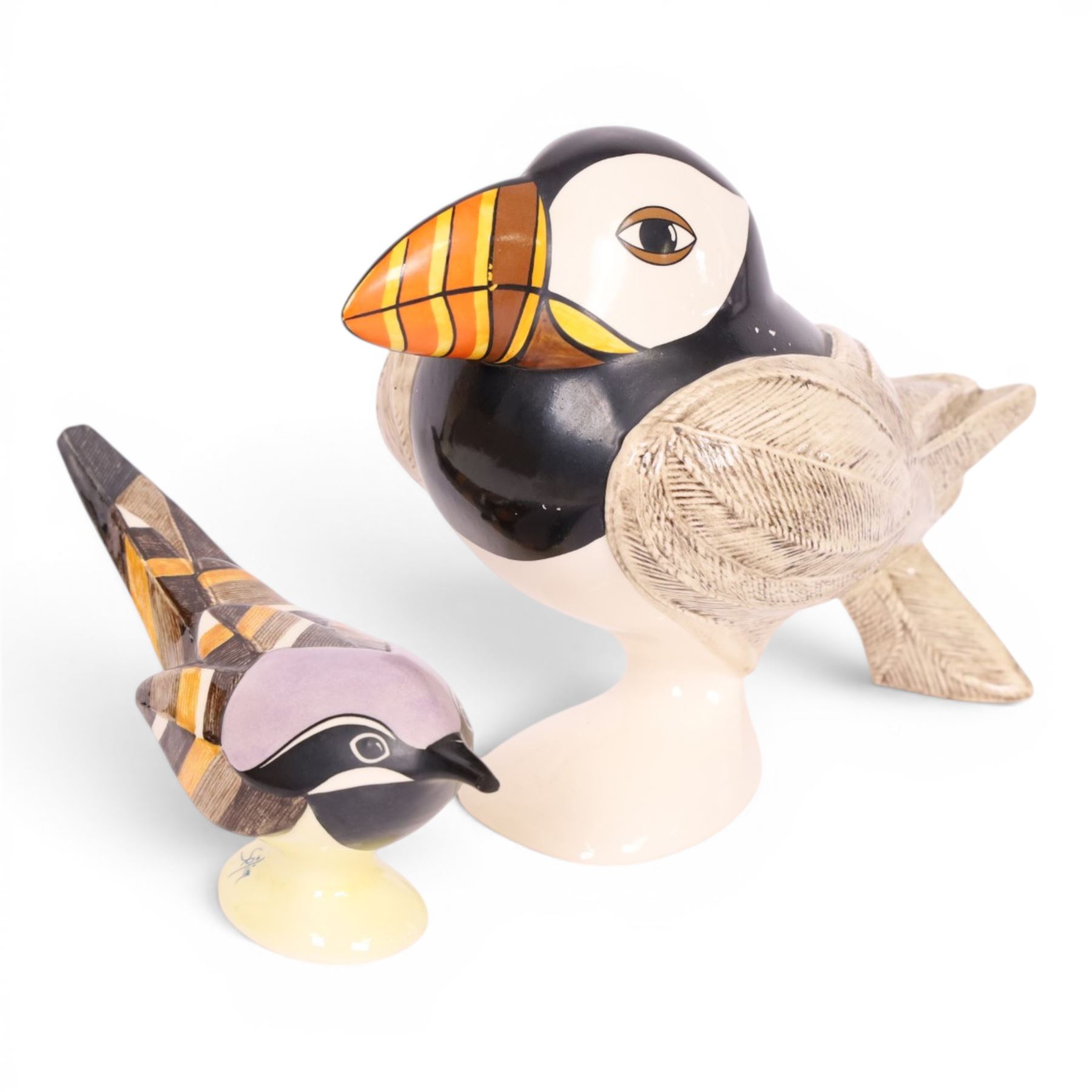 Collection of Goebel bird figures signed by designer George Selim, including two Jays, a Puffin and three others 
