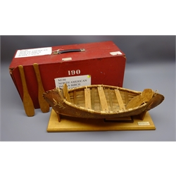  20th century Educational model of an Ojibwa North American Birch Bark Canoe with two paddles, on named stand with info. card in fitted travel box, model L60cm   