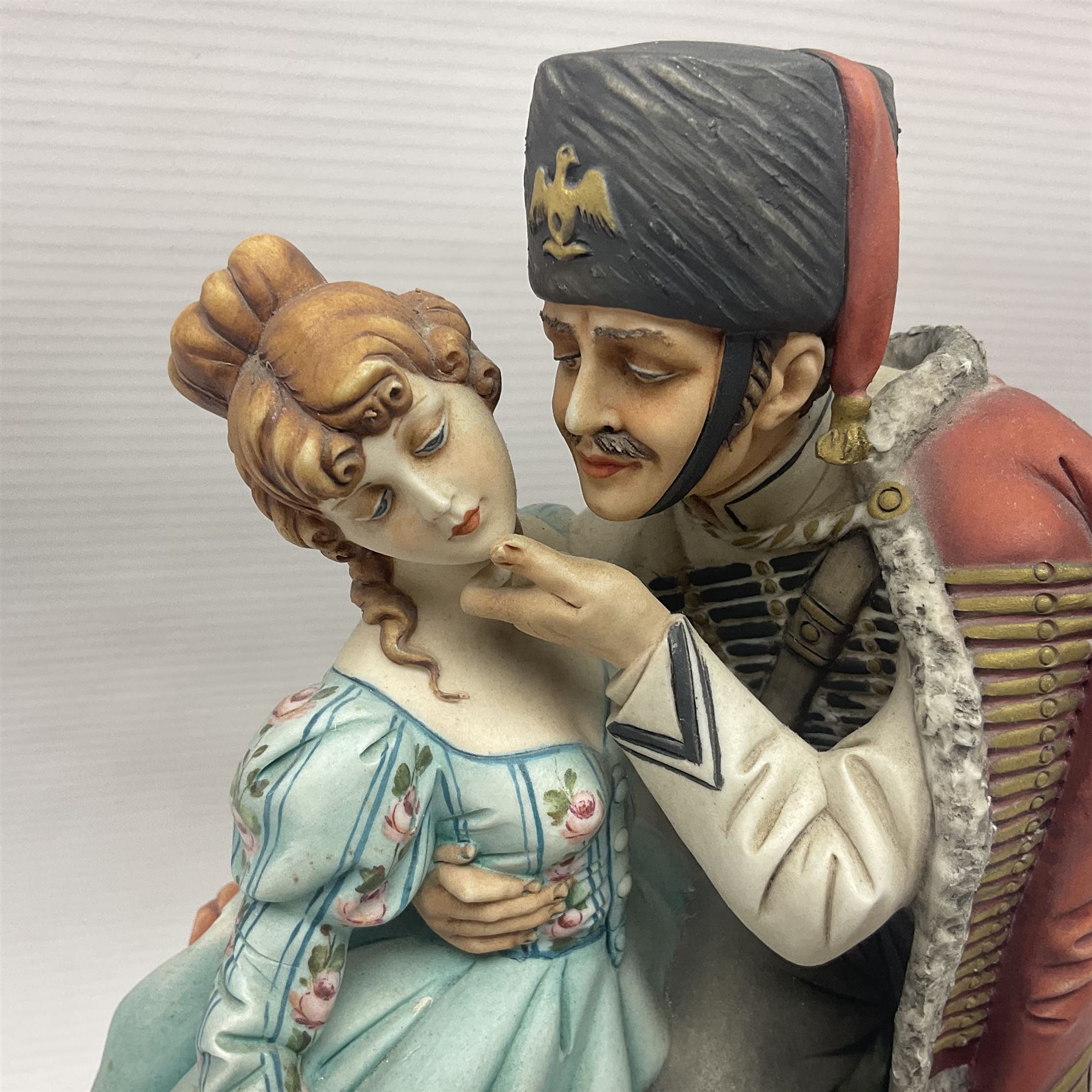 Two Royal Doulton figures, Buttercup HN2309 and Ascot HN2356, together with Capodimonte figure Hussar and His Lady 