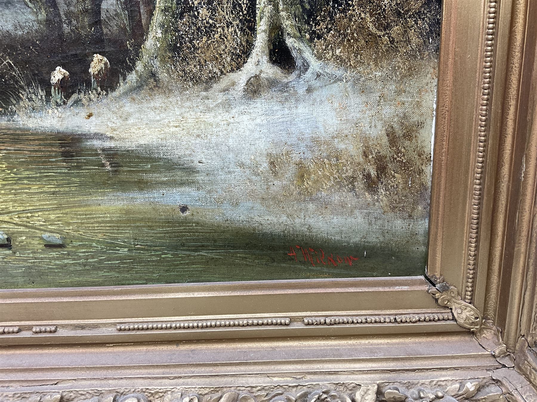 A Wilkow (Polish 19th/20th Century) Blacksmith's Workshop in a Winter Landscape, oil on canvas signed 71cm x 97cm in heavy ornate plaster gilt frame