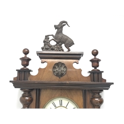 Late 19th century Vienna type wall clock in walnut case,  figural pediment above glazed door with half turned pilasters, single weight driven movement stamped '159964', H132cm