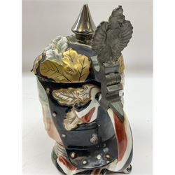 Otto Von Bismarck figural 0.5l stein, his black pickelhaube helmet with chrome spike serving as the lid, in green uniform and gilt detail throughout, pewter thumb hinge, with blue hash Musterschutz type mark, H18cm