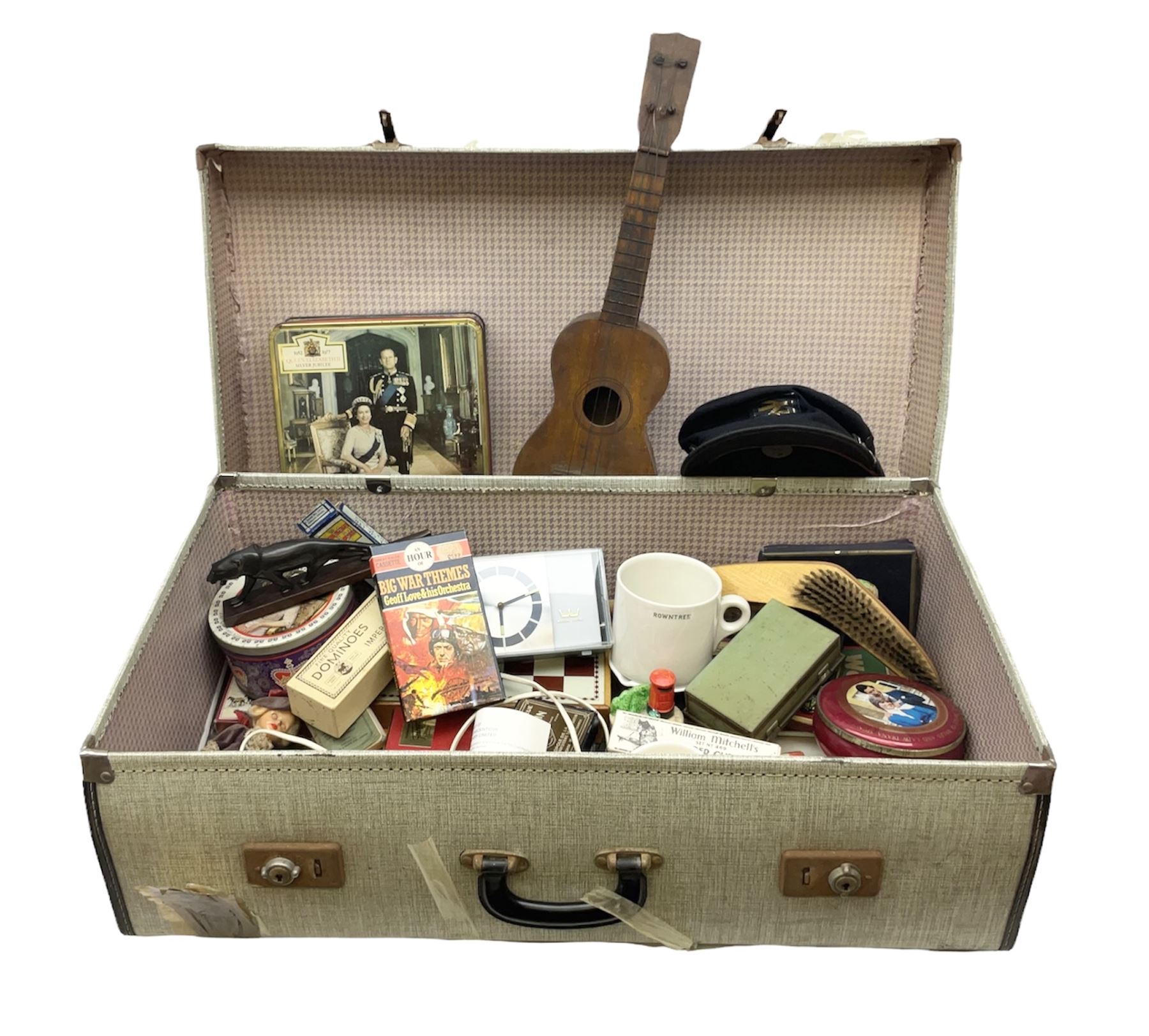 Ukelele, Westclox electric alarm  clock, vintage tins, National Rail hat, ceramics, boxed games, carved wood figures etc all housed in a suitcase