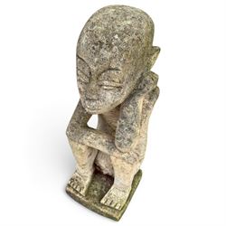 Balinese design weathered cast stone figure of an ancestral guardian, modelled in a squatting pose 