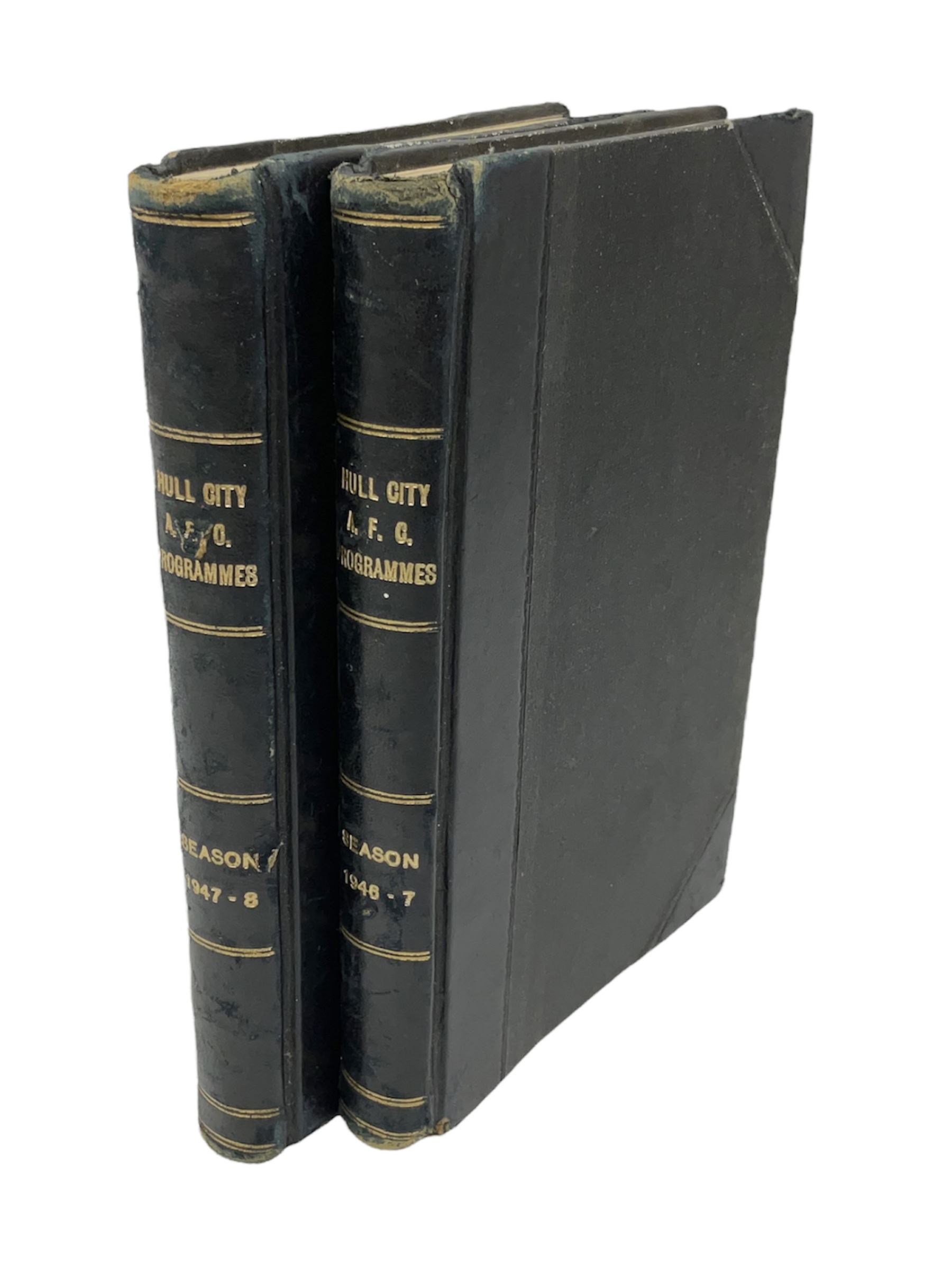 Hull City A.F.C. - two bound volumes of 1940s home match programmes; volume one 1946-7 season containing twenty-six programmes from 31/8/46 to 7/6/47 including Hull City Boys game 5/4/47 against Leicester Boys; volume two 1947-8 season containing twenty-five programmes including Raich Carter's first game 3/4/48 having taken over as player/manager 1/4/48. Uniformly bound in black half leather. Provenance: By direct descent from the family of Raich Carter having been consigned by his daughter Jane Carter.