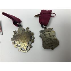 Two Edwardian hallmarked silver presentation fobs for military bugling competitions; and quantity of cap/glengarry and other badges, sweetheart brooches etc