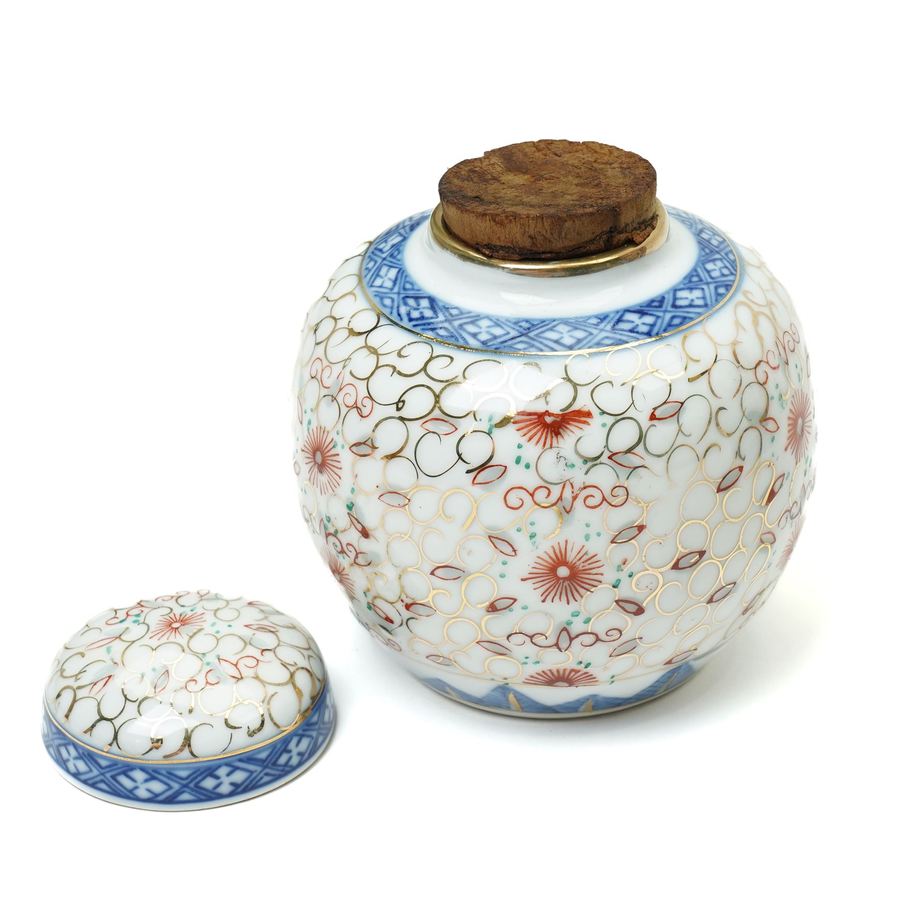 Late 19th/Early 20th century Japanese Imari bowl decorated with panels of flowers in blue, orange and green etc D27cm, Imari vase H24cm and a small ginger jar (3)
