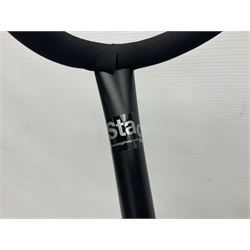 Four folding tubular guitar stands, two by RockJam; and folding tubular saxophone stand (5)