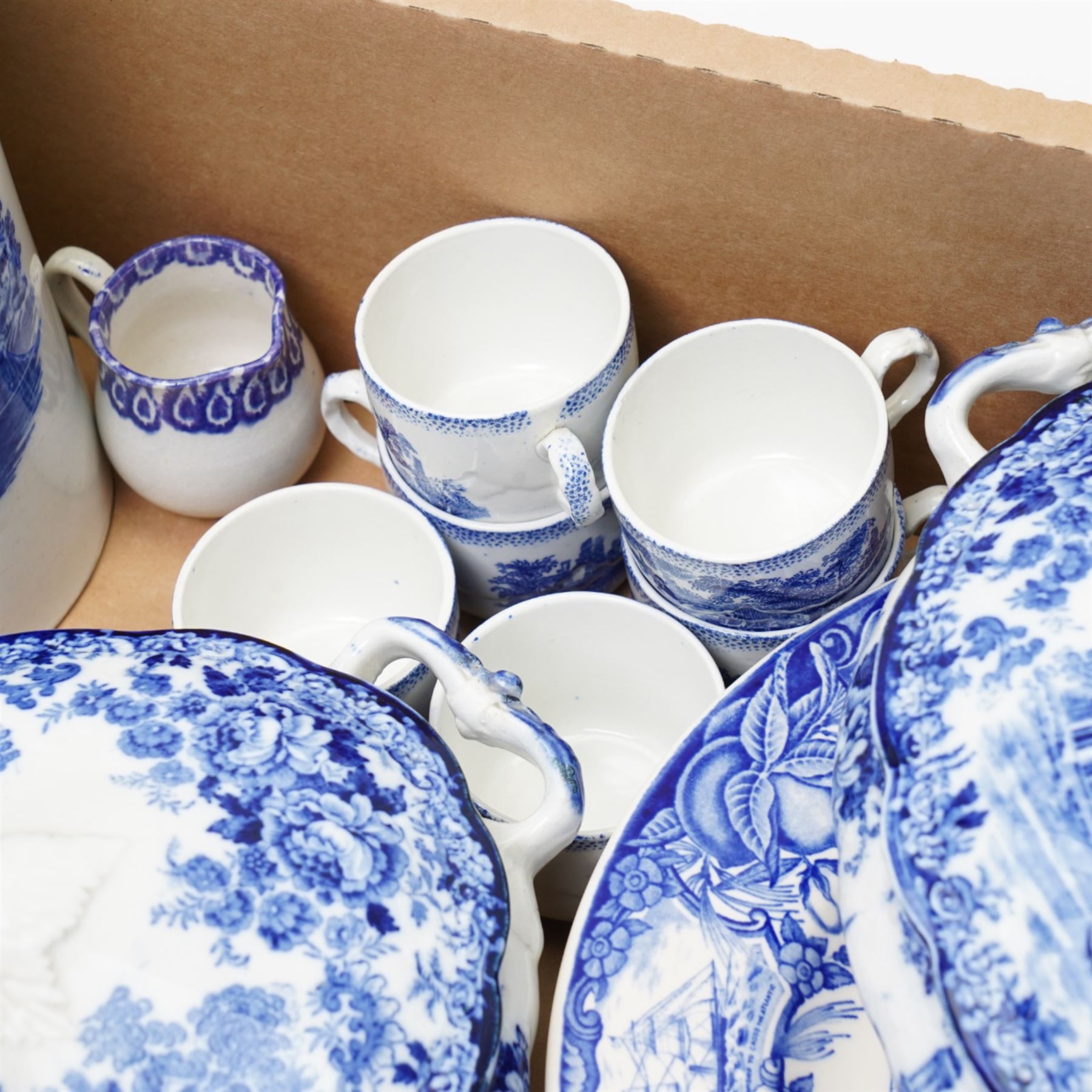 Large collection of mixed blue and white, including two covered tureens, miniature Ridgway tea service, etc in one box