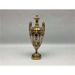 Mid 20th century Royal Crown Derby Old Imari 1128 pattern urn,  circa 1964-1975, of slender ovoid form with gilt scroll handles and fixed cover, upon a pedestal base with canted corners, with printed mark beneath, H30cm