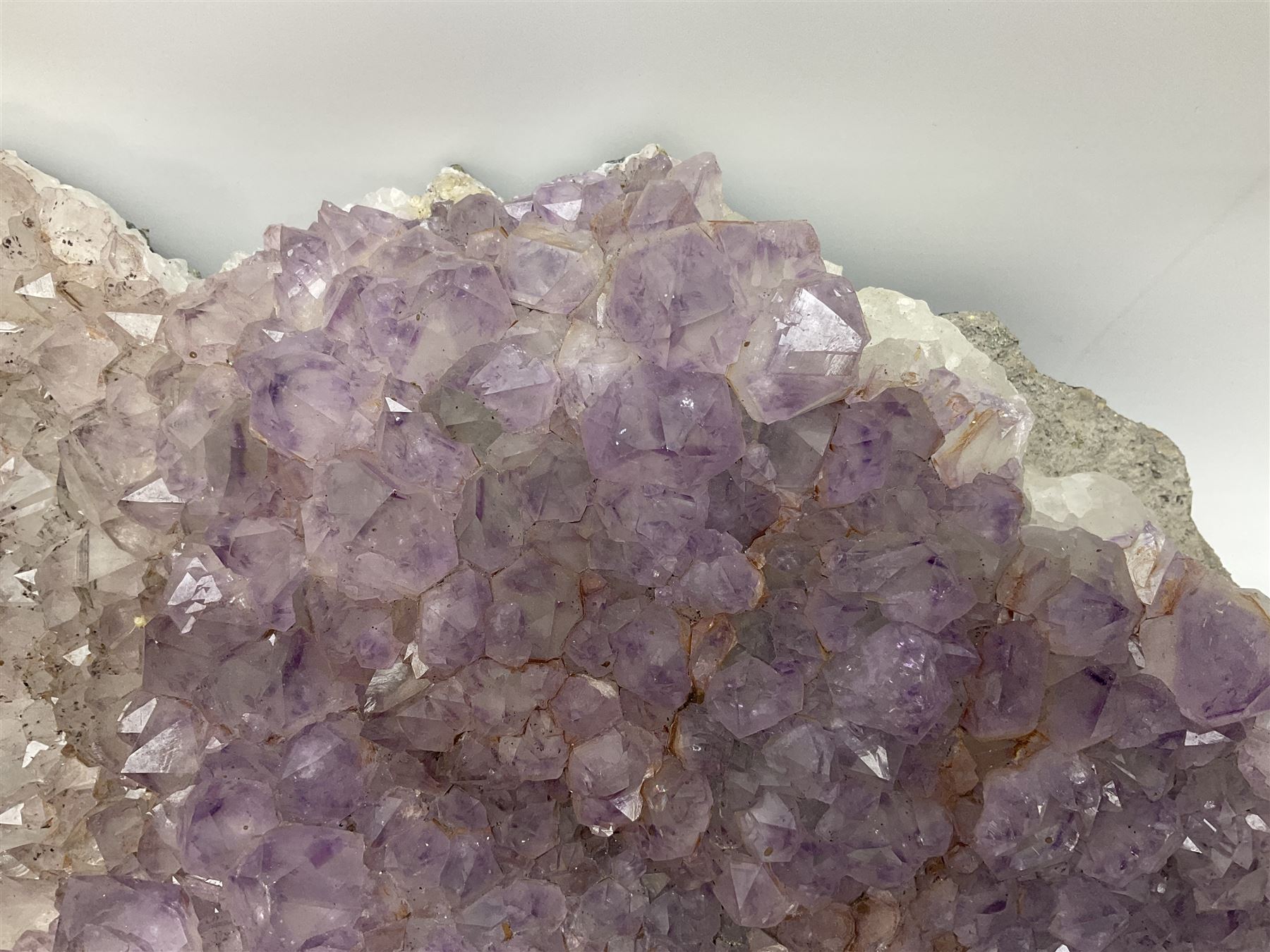 Amethyst crystal geode cluster, with well-defined crystals of various sizes, H13cm, L46cm