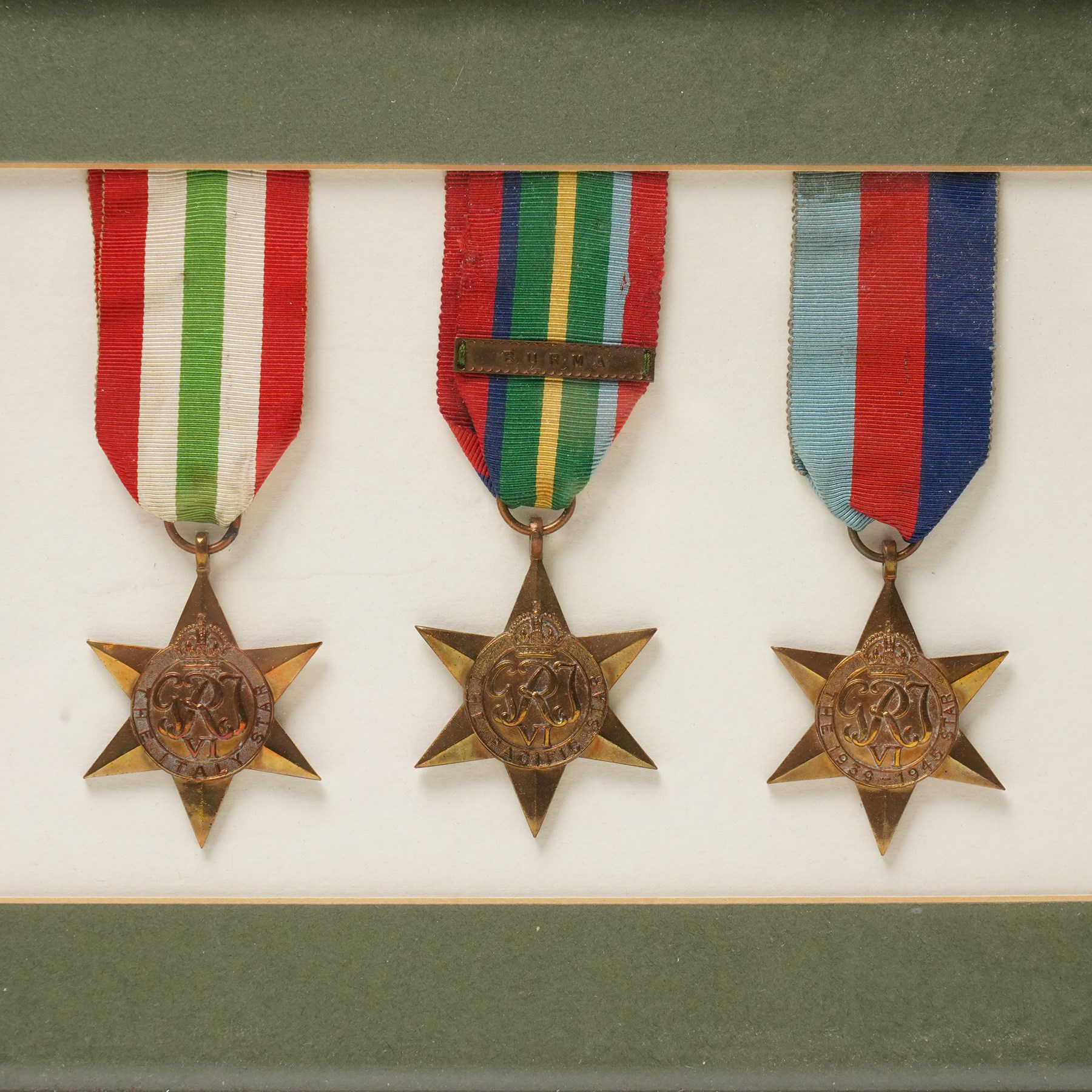 Group of six WWII medals comprising War Medal, 1939-1945 Star, Pacific Star with Burma clasp, Italy Star, Atlantic Star and Africa Star, framed