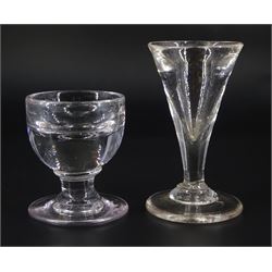 19th century toastmasters glass, the trumpet bowl upon firing type foot, H10cm, together with a further 19th century toastmasters/ penny lick type glass with deceptive rounded bowl upon firing type foot, H7cm