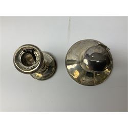 1920's silver mounted capstan inkwell, hallmarked Charles Boyton & Son Ltd, London 1929, together with an early 20th century silver mounted dwarf candlestick, hallmarked A J Pepper & Co, Birmingham 1918