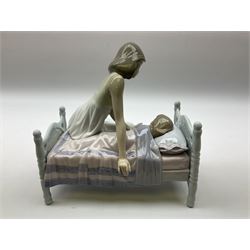 Lladro figure, Sleep Tight, modelled as a mother putting her daughter to bed, in original box, no 5900, year issued 1992, year retired 1997, H20cm