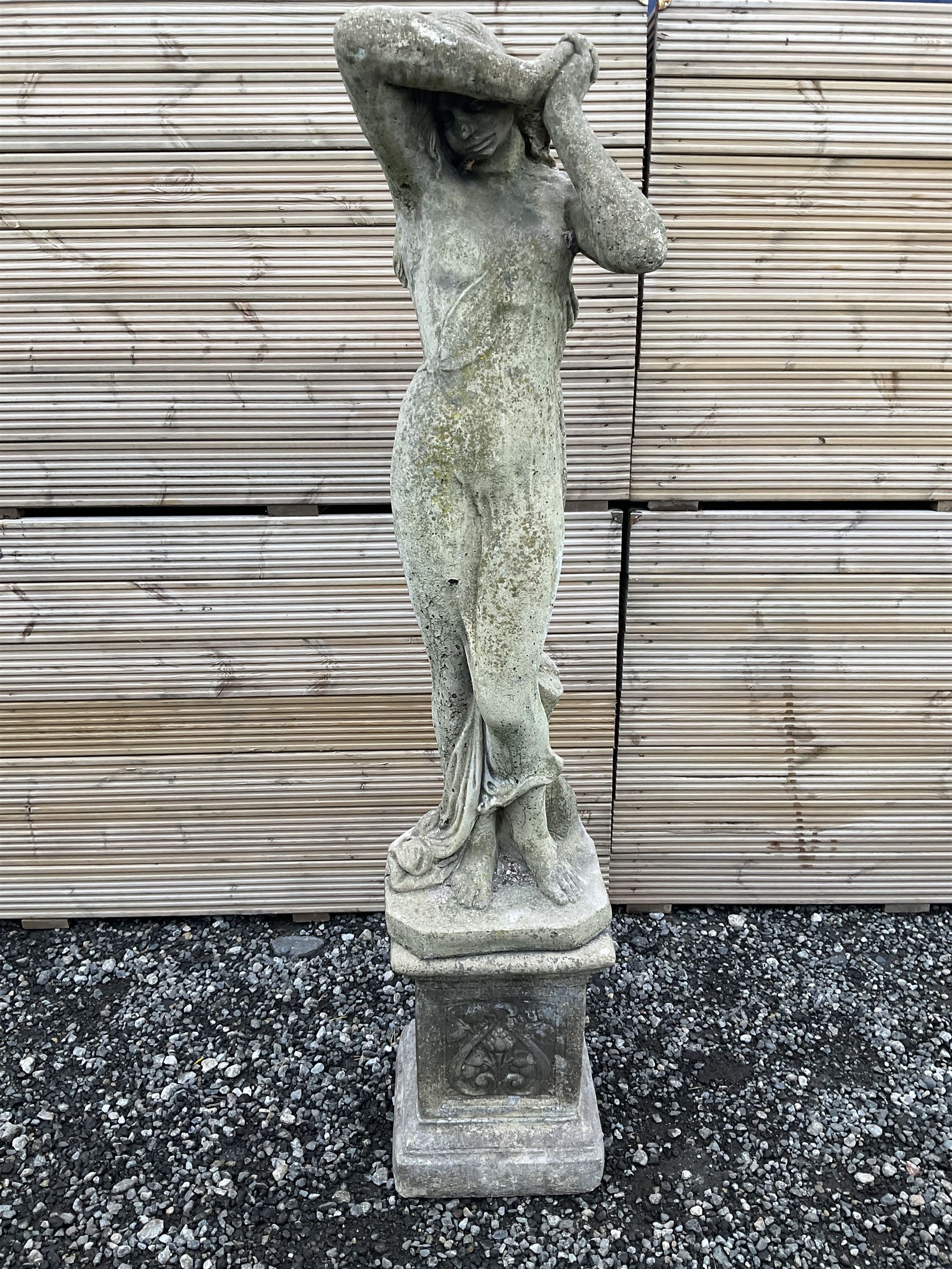 Cast stone garden figure of a woman with arms raised - THIS LOT IS TO BE COLLECTED BY APPOINTMENT FROM DUGGLEBY STORAGE, GREAT HILL, EASTFIELD, SCARBOROUGH, YO11 3TX