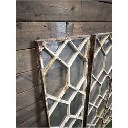 Four 19th century cast iron windows, lattice glazed in white painted finish, 