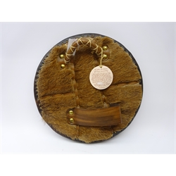  Replica Scottish Highlander's Targe by Joe Lindsay, based on an original targe which belonged to Cameron of Lochiel, 1746, the wooden shield covered in tooled leather with traditional Celtic designs, brass studs and mounts with deer skin hide verso, D49cm   