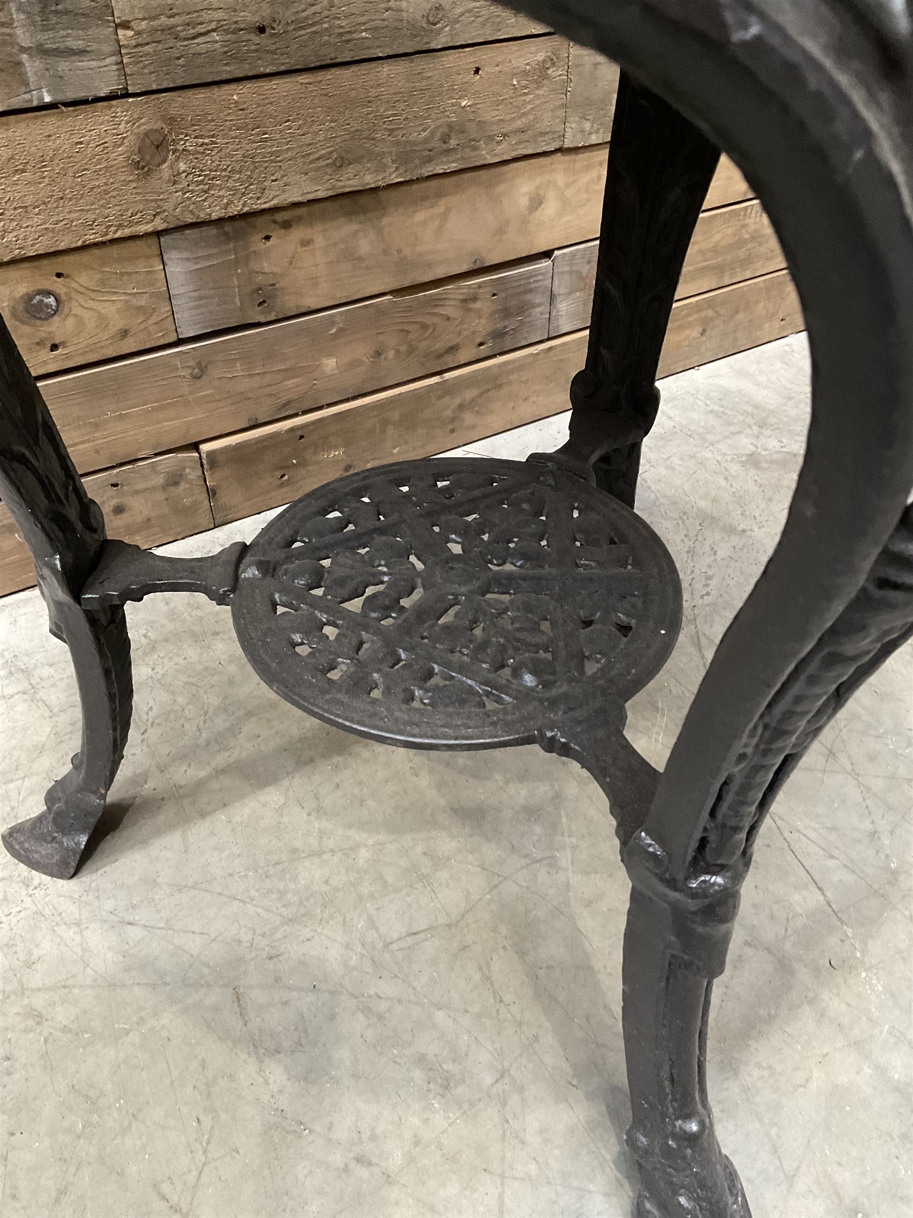 Cast iron Britannia circular pub table, and two pedestal cast iron bases (3)