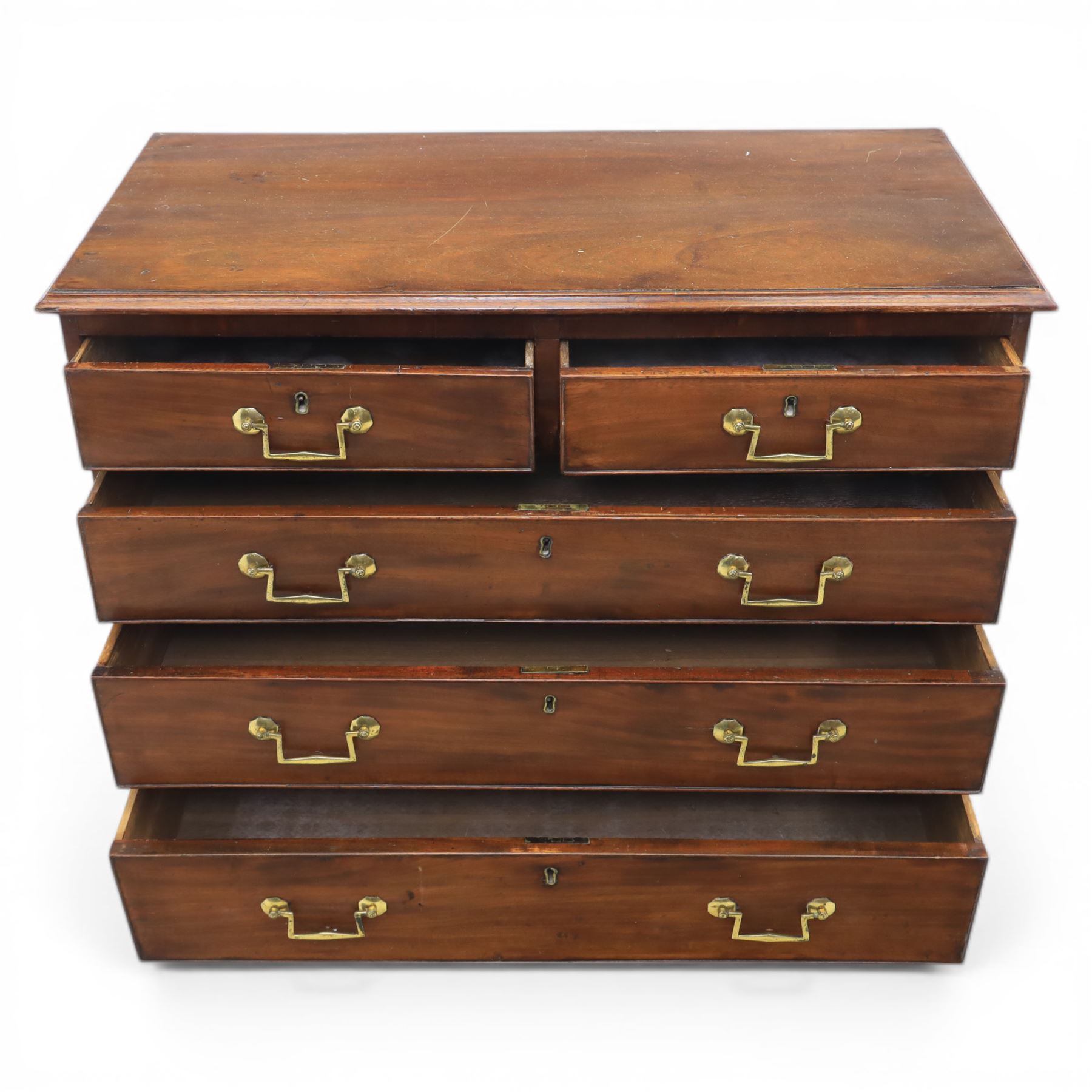 Small late Georgian mahogany chest, rectangular moulded top, above two short and three graduating long drawers, finished with square swan neck handles, raised on ogee bracket feet 