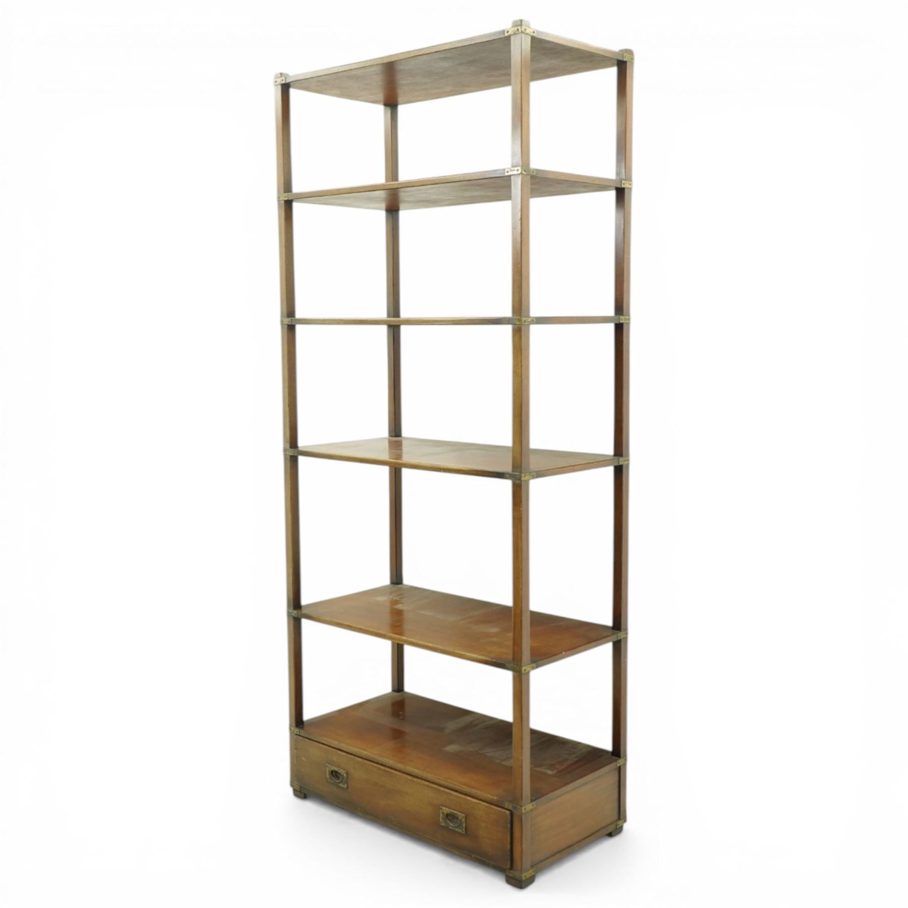 Late 20th century mahogany open bookcase, rectangular form with five open shelves and brass mounted corner brackets, fitted with single lower drawer with recessed brass campaign handles, on block feet