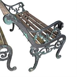 Pair of Victorian Revival Coalbrookdale design 'Dog and Serpent' pattern benches with slatted seats, the cast iron end supports of pierced and scrolling design with dog mask arm terminals