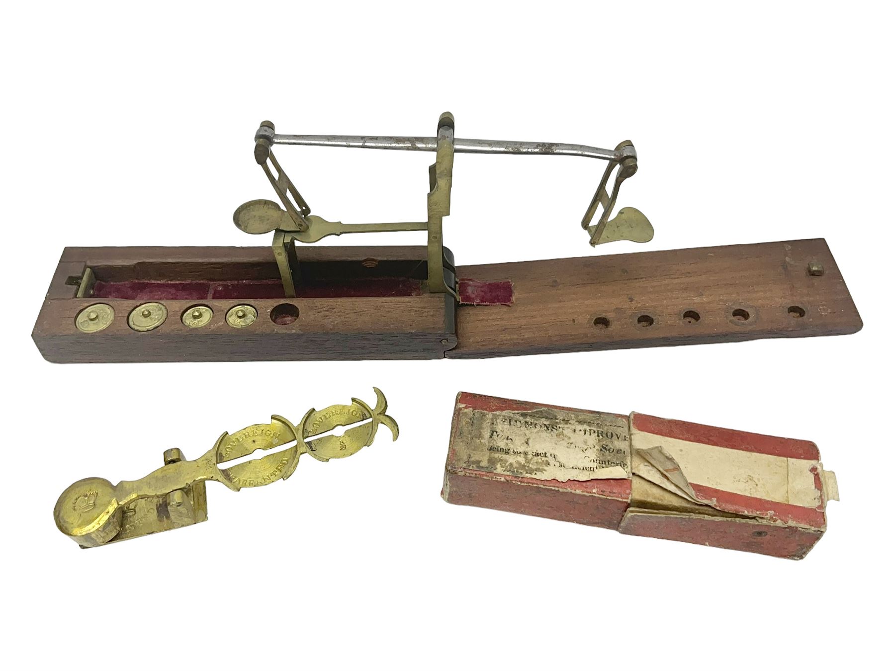 Brass sovereign scales and a part set of Georgian folding sovereign scales (one weight missing)