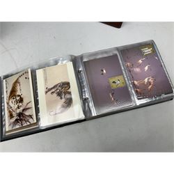 Mostly Chinese stamps including  covers and postcards, many being from the 80s and 90s, housed in ten folders