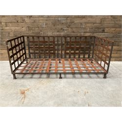 Wrought iron strapwork garden day bed, lattice back and sides