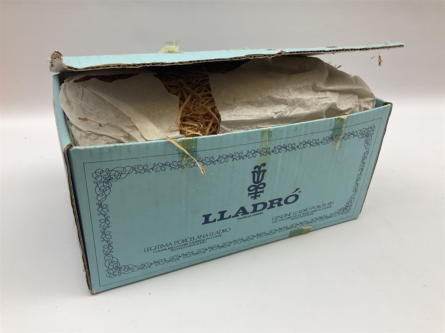 Lladro figure, Ford Fiesta, modelled as a Ford in beige, special commission by the Ford factory in Valencia, original box, no 7608, year issued 1989, year retired 1989, H9cm 