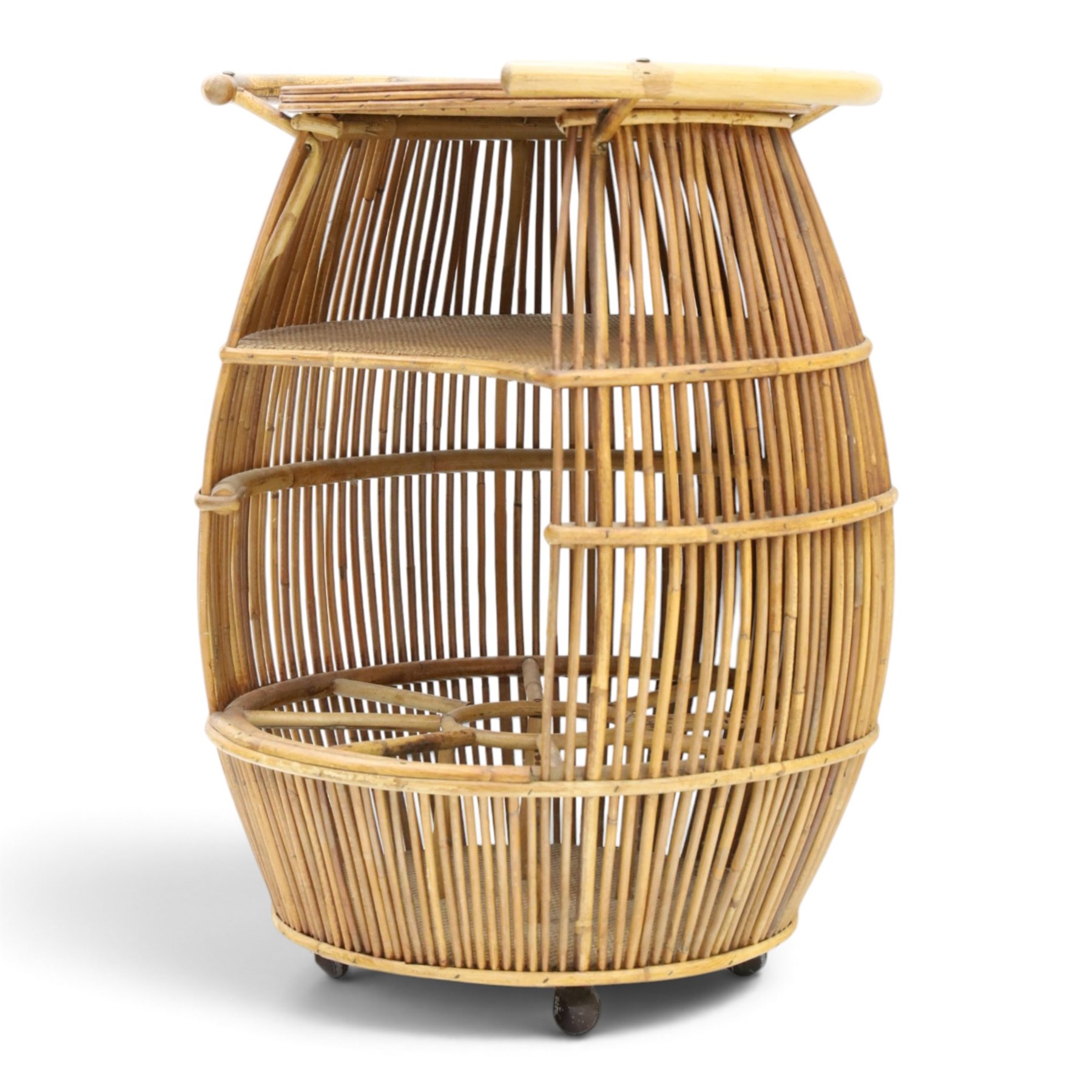Italian mid-20th century barrel-shaped bar cart in rattan and bamboo, the circular top with rattan and bamboo handle, above a rattan shelf with bamboo bottle dividers below, raised on castors