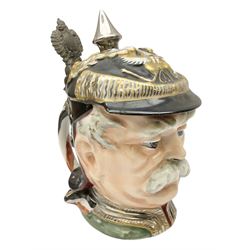 Otto Von Bismarck figural 0.5l stein, his black pickelhaube helmet with chrome spike serving as the lid, in green uniform and gilt detail throughout, pewter thumb hinge, with blue hash Musterschutz type mark, H18cm