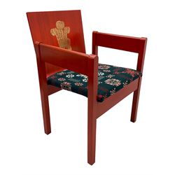 Prince Charles Investiture Chair - designed by Lord Snowdon, manufactured by Remploy, 1969, red finish and decorated with the Prince of Wales's feathers and moto 'Ich Dien' in gilt, later upholstered seat in 1950s design Welsh blanket weave fabric 