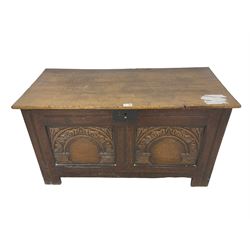 Jacobean Revival - 19th century oak blanket chest, rectangular hinged top, the two front panels carved arched foliate decoration, raised on stile supports