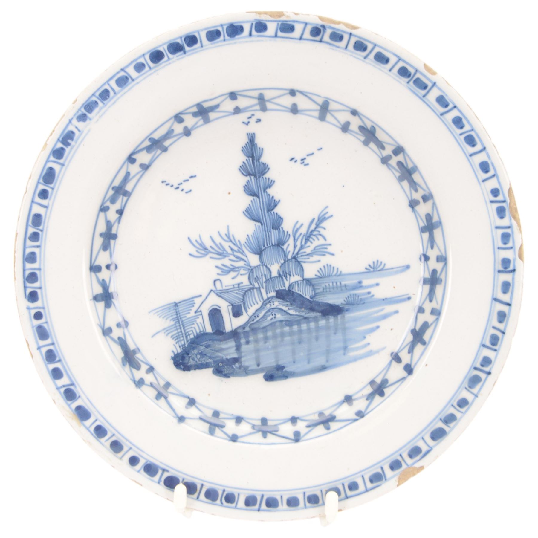 Five 18th century blue and white English and Dutch Delft plates, to include an example probably by the Abigail Griffith Delftworks in Lambeth, London, circa 1765-1775, depicting a landscape scene with house and tree, contained within geometric borders, D23cm, largest example D30cm 